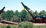 Southern Railway 250-ton Industrial Brownhoist derricks/wreckers #903016 and 903026 work to place Conrail flat car #716074 and its load back on the rails 